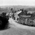 Knighton Hill, probably between 1922 and 1928. The turn to the right is the current sharp bend on the main road from Plymouth. The cottages on the right were, in the large majority of cases, rented by agricultural labourers. 